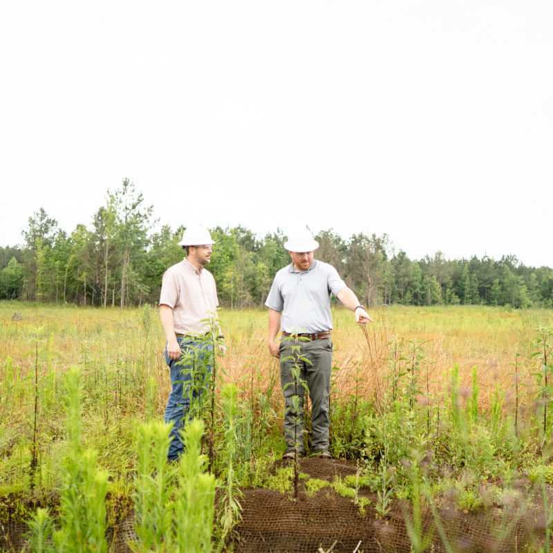 Two Mitigation Employee Wearing Hard Hat Visting Tennessee Mitigation Banks Site